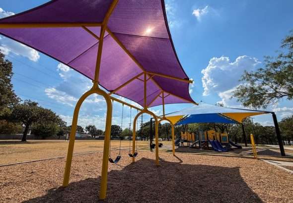Three Bedford Parks Receive New Swing Sets With Shade Coverings