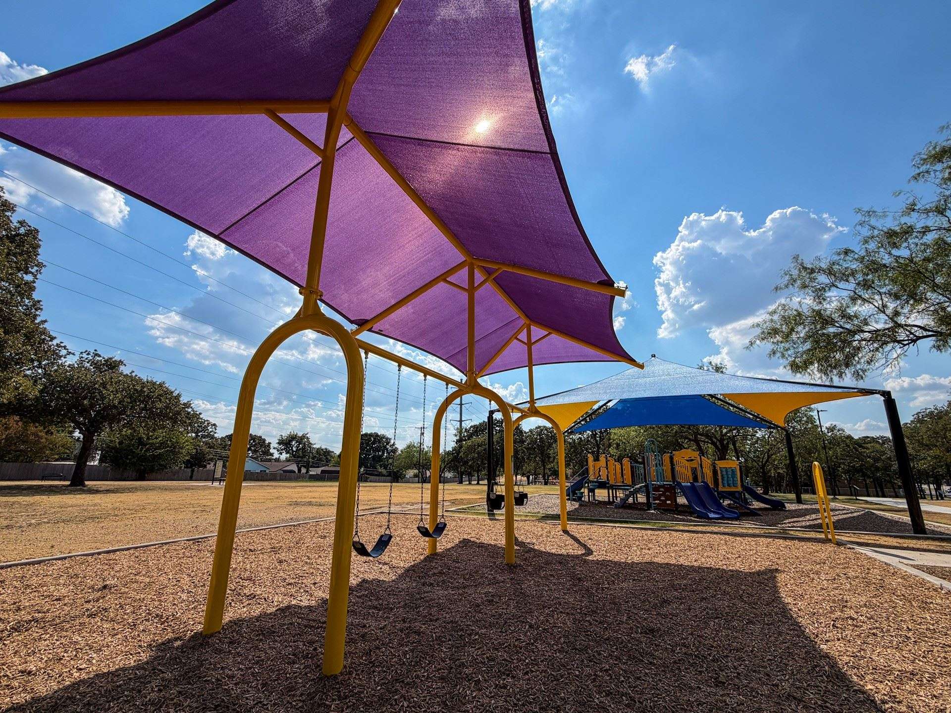 Three Bedford Parks Receive New Swing Sets With Shade Coverings